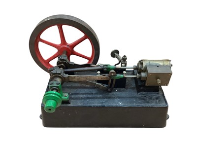 Lot 1861 - Flywheel with single cylinder engine, on cast metal and one other (2)