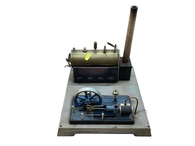 Lot 1869 - Possibly Fleischmann stationary steam engine with single cylinder fly wheel, on pressed steel plinth (1)