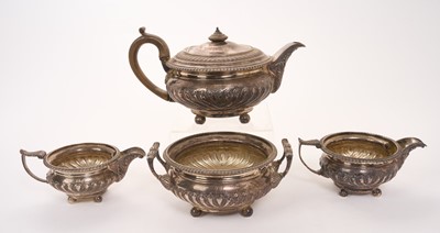 Lot 446 - George III silver teapot of cauldron form with fluted decoration and gadrooned border, fruitwood finial and handle, raised on four ball feet