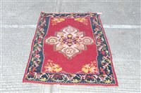 Lot 1441 - Kelim rug - with claret ground and central...