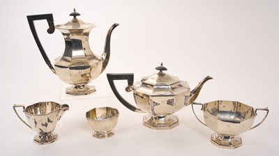Lot 457 - George VI silver coffee pot of faceted octagonal form with angular ebonised handle and ebonised finial, the body engraved with the initial 'R'