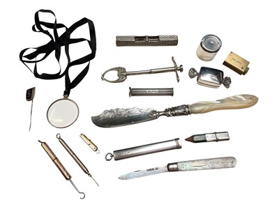 Lot 205 - Group of small silver items including a sweet shaped pill boxes, pencil holder, mother of pearl fruit knife, sovereign holder