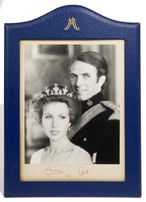 Lot 103 - Anne, Princess Royal and Captain Mark Phillips CVO signed Royal presentation photograph, 1975. A large and impressive portrait given by Princess Anne and her first husband to Commodore The Hon S...