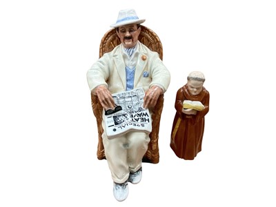 Lot 2358 - Royal Doulton figure - Taking Things Easy HN2680, together with a Royal Worcester candle snuffer in the form of a friar (2)