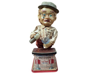 Lot 1894 - Rosko Charley Weaver battery operated bartender, Schucco clockwork monkey violin player and other tin plate clockwork toys (8)