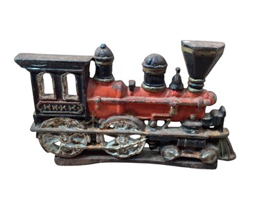 Lot 1895 - Cast iron door stop "Train", flat iron, money box clown and other items (1 box)