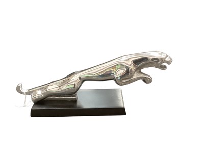 Lot 3006 - Polished metal Jaguar Cars desk ornament / mascot mounted on rectangular base, 30.5cm in length.