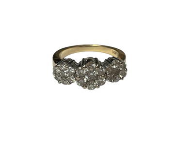 Lot 279 - Diamond triple flower head cluster ring in claw setting on yellow gold shank, marked 14K. Ring size N½