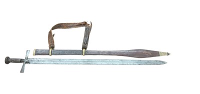 Lot 818 - 19th century Sudanese Kaskara sword with cruciform hilt, broad tapering double-edged fullered blade in tooled leather covered scabbard with swollen tip