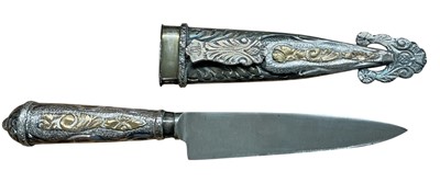 Lot 816 - Argentinian Gaucho hunting knife with ornate white metal grip with foliate decoration and steel blade in white metal scabbard with foliate decoration, stamped Ind. Arg. Alpaca, 24cm in overall l...
