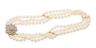 Lot 634 - Cultured pearl three strand necklace with diamond clasp