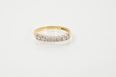 Lot 642 - 18ct gold diamond seven stone eternity ring