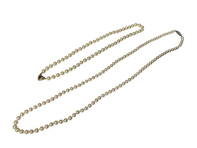 Lot 286 - Two cultured pearl necklaces, one with a 9ct gold clasp and the other with a silver clasp (2)