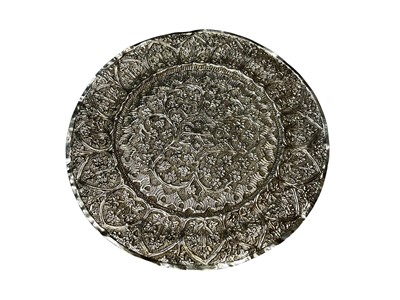 Lot 243 - Eastern white metal dish with embossed floral scroll decoration, 12.5cm diameter