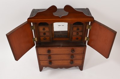 Lot 945 - Early 19th century miniature mahogany linen press