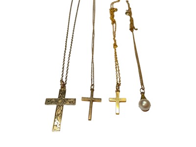 Lot 257 - Three 9ct gold cross pendants and a 9ct gold mounted cultured pearl pendant, three on 9ct gold chains and one on a plated chain...