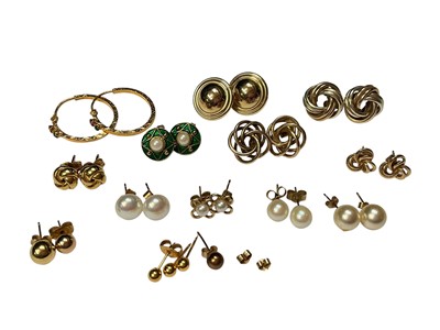 Lot 262 - Group of 9ct gold and yellow metal earrings including cultured pearl studs, knot designs, pair of Indian yellow metal hoops etc