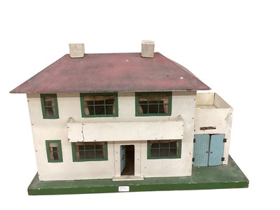 Lot 1914 - 1930s dolls house painted cream with green metal window frames, four rooms, front opening, plus villa style dolls house.