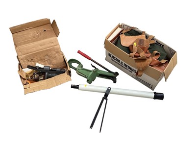 Lot 5288 - Group of leather gun holsters, scope and gun related equipment.