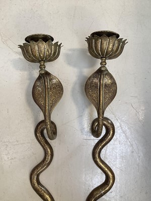 Lot 5107 - Pair of Indian brass wall-mounted snake candle holders