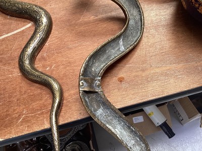 Lot 5107 - Pair of Indian brass wall-mounted snake candle holders