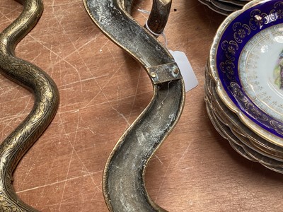 Lot 5107 - Pair of Indian brass wall-mounted snake candle holders