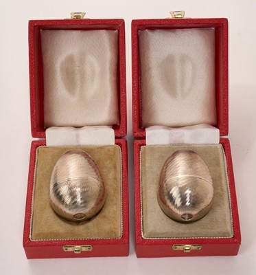 Lot 444 - Two silver surprise eggs in the manner of Stuart Devlin, marked for Nicholas Plummer