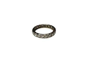 Lot 268 - Diamond eternity ring with a full band of twenty brilliant cut diamonds