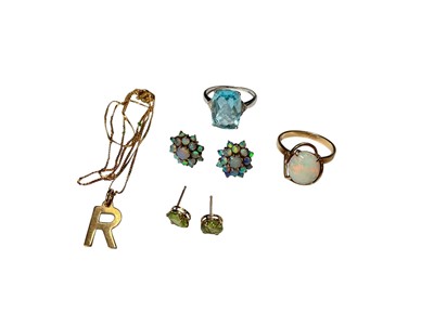 Lot 297 - Group of 9ct gold jewellery to include an opal ring, pair of opal cluster earrings, R initial pendant on chain, white 9ct gold blue stone dress ring and pair of peridot earrings, stamped 10K