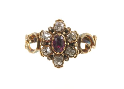 Lot 675 - Antique diamond and garnet flower head cluster ring