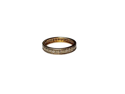 Lot 302 - Diamond eternity ring in yellow metal setting