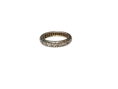 Lot 303 - Diamond eternity ring in a precious white metal setting