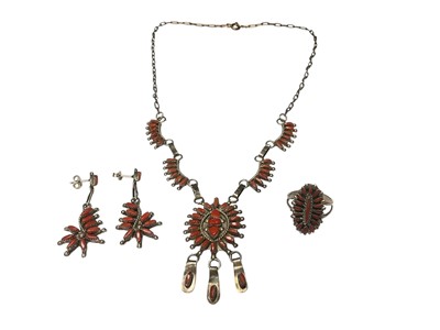 Lot 306 - Eastern style white metal and coral suite of jewellery comprising pendant necklace, pair of earrings and a ring (3)
