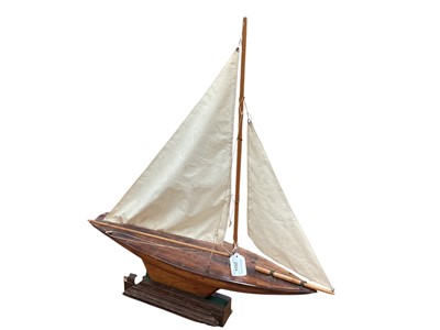 Lot 2924 - Three wooden model yachts on stands, the largest 60cm long