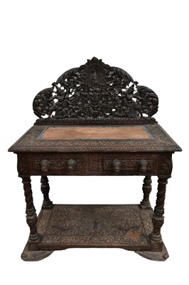 Lot 1362 - 19th century Burmese carved hardwood side table, with ornate carved and pierced gallery and two frieze drawers with mask handles, on carved turned legs united by a relief carved undertier, 98cm...