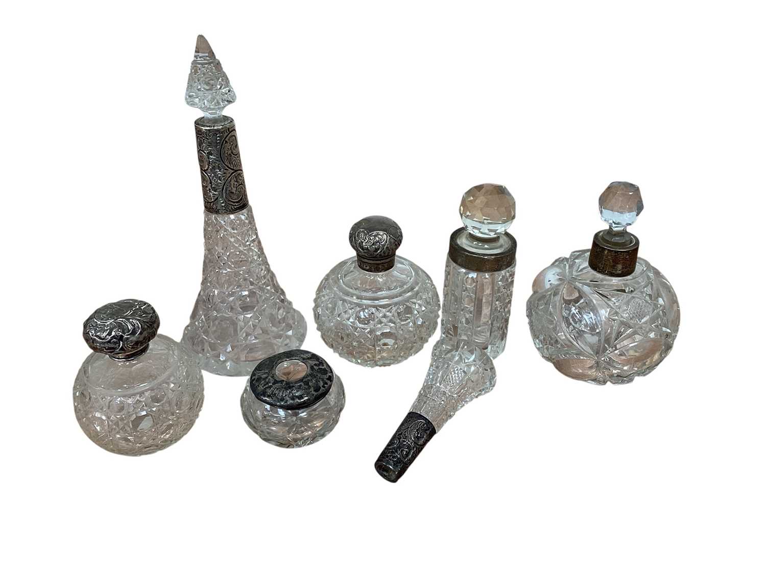Lot 5038 - Group of silver topped scent/perfume bottles and other silver topped items
