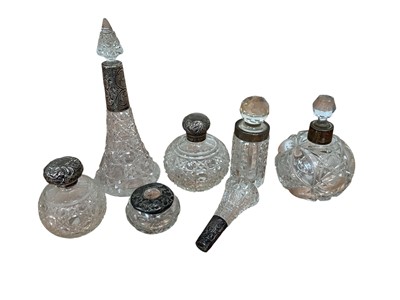 Lot 5038 - Group of silver topped scent/perfume bottles and other silver topped items