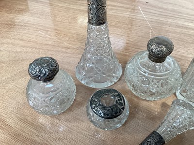 Lot 5038 - Group of silver topped scent/perfume bottles and other silver topped items