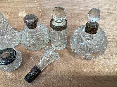 Lot 5038 - Group of silver topped scent/perfume bottles and other silver topped items