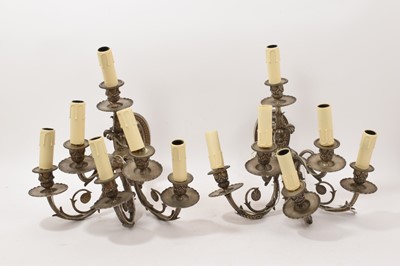 Lot 1036 - A pair of silvered bronze six-light wall appliqués