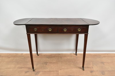Lot 1381 - Unusual Regency mahogany side table, rectangular top with drop leaf elliptical ends, having two frieze drawers and opposing dummy drawer on slender square tapered legs and castors, 79cm wide x 4...