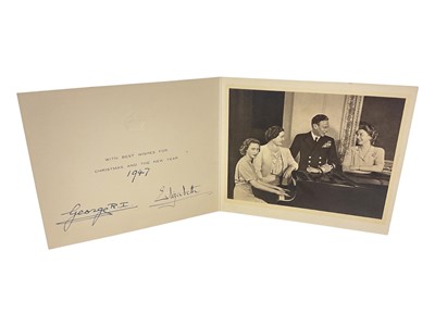 Lot 89 - T.M. King George VI and Queen Elizabeth, signed 1947 Christmas card with gilt crown to cover, black and white photograph of their Majesties Royal Gamily around a piano, signed 'George R.I 1947 El...