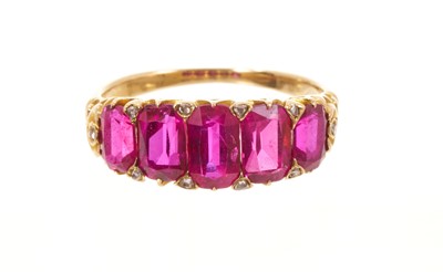 Lot 558 - Victorian ruby five stone half hoop ring with five graduated rubies with rose cut diamond accents to the claws, in carved gold setting on tapered shank, ring size J½.
