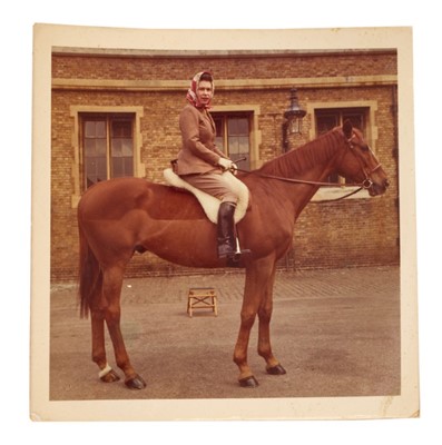Lot 95 - H.M. Queen Elizabeth II, scarce 1970s informal colour photograph of Her Majesty on horseback