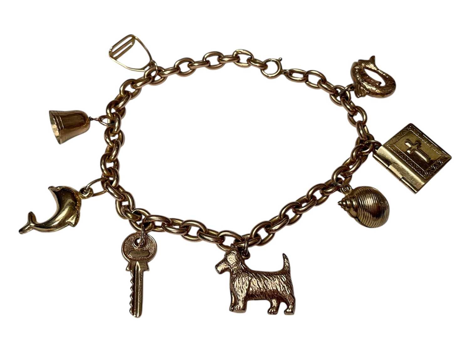 Lot 12 - 9ct gold charm bracelet with eight novelty charms