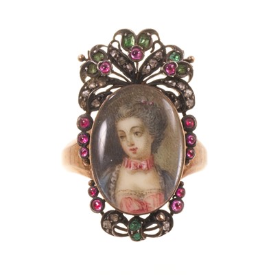 Lot 562 - Antique French ring with a portrait miniature on ivory depicting the bust of a young lady, the oval glazed bezel surmounted by pierced cresting and framed with diamonds, rubies and emeralds, on...