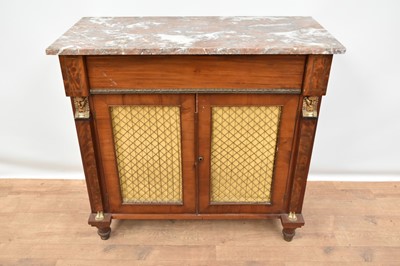 Lot 1429 - Marble topped Egyptian revival mahogany chiffonier, enclosed by a pair of fabric lined brass grille doors, flanked by Egyptian style terms, 102cm wide x 46cm deep x 94cm high