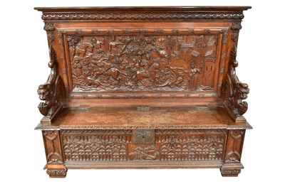 Lot 1430 - Good 19th century carved oak hall bench, the high back carved in high relief with mediaeval hunting scene and hinged seat flanked by dragon figures, the front with ornate tracery on carved feet,...
