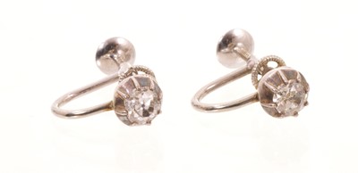Lot 580 - Pair of antique diamond single stone earrings, each with an old mine cut diamond in silver collet setting with later white metal screw fitting, estimated total diamond weight approximately 0.50-...