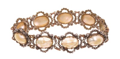 Lot 566 - Antique coque de pearl / mother of pearl and cut steel bracelet with nine oval panels, 19cm length